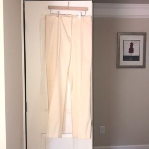 Beige embroidered pants.